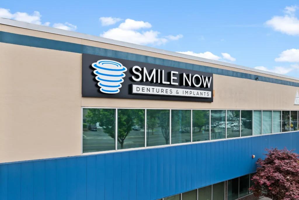 Exterior of office building with sign at Smile Now Reno Dentures and Implants